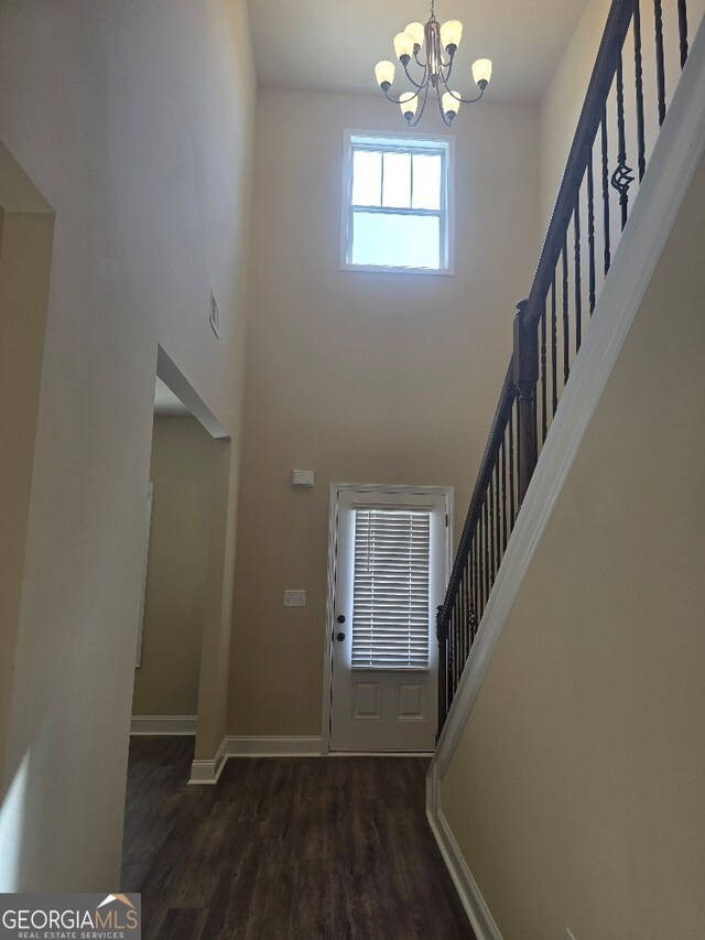 hall featuring dark hardwood / wood-style floors and crown molding