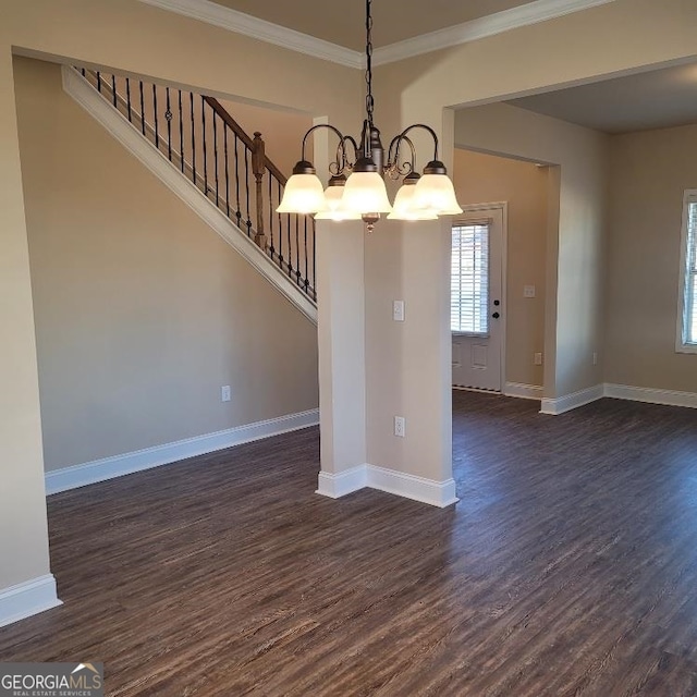 unfurnished dining area featuring dark wood-type flooring, a notable chandelier, and ornamental molding