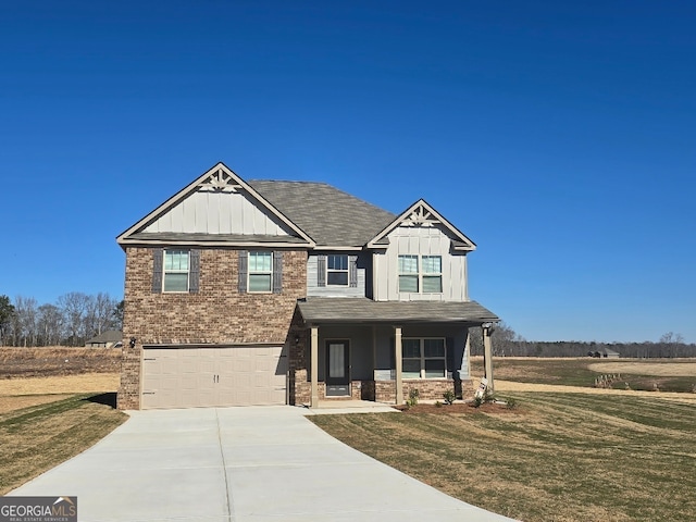 craftsman inspired home with a garage, a front yard, and a porch