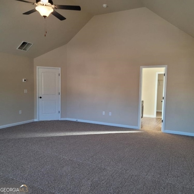 interior space featuring high vaulted ceiling, light carpet, and baseboards