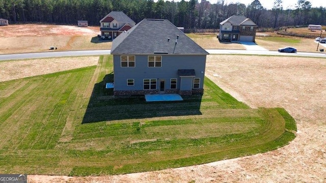 drone / aerial view featuring a forest view