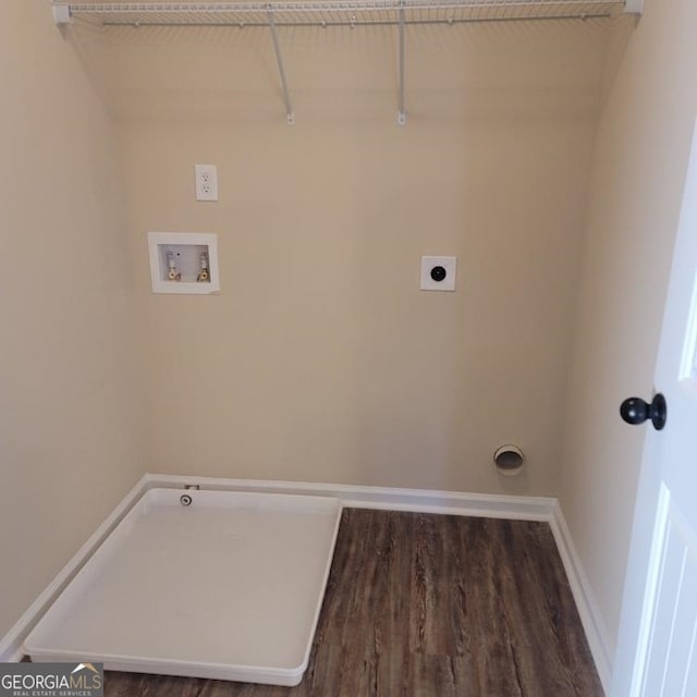 clothes washing area with baseboards, laundry area, washer hookup, and hookup for an electric dryer