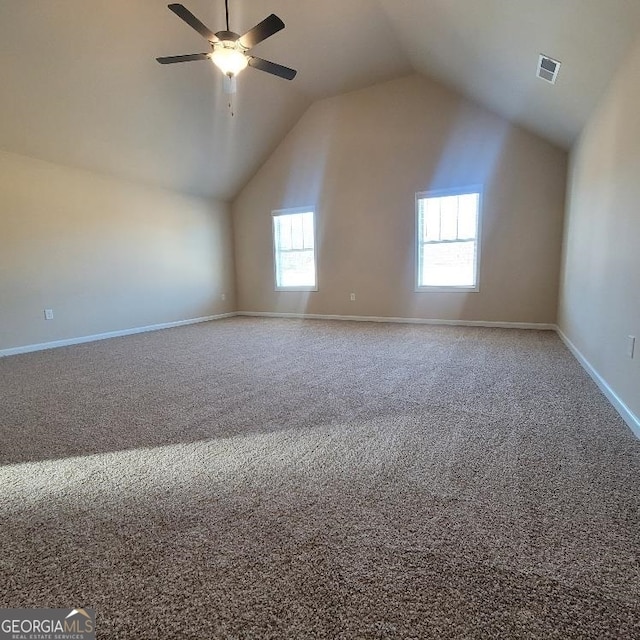 bonus room with lofted ceiling, carpet flooring, visible vents, and baseboards