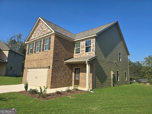 view of front of home featuring a front yard and a garage