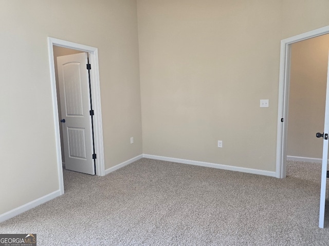 spare room with light colored carpet