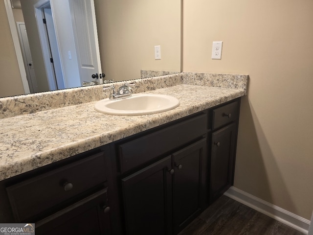 bathroom with wood-type flooring and vanity