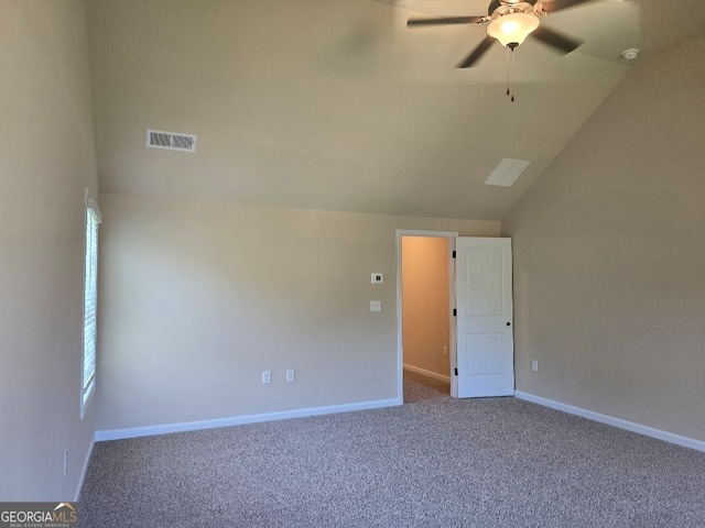 spare room with carpet floors, vaulted ceiling, and ceiling fan