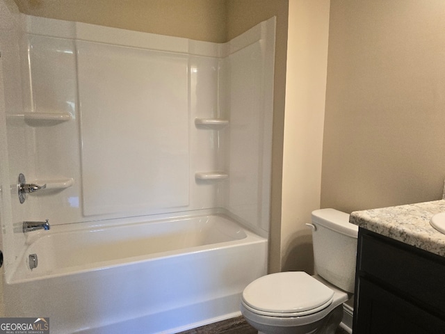 full bathroom with tub / shower combination, vanity, and toilet