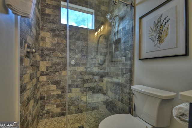 bathroom with walk in shower and toilet