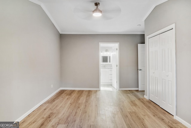 unfurnished bedroom with connected bathroom, ceiling fan, light hardwood / wood-style floors, a closet, and ornamental molding