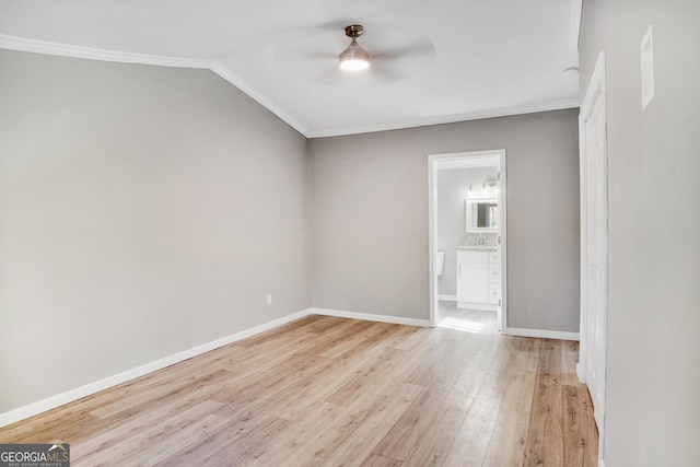 unfurnished room featuring crown molding, ceiling fan, light hardwood / wood-style floors, and lofted ceiling