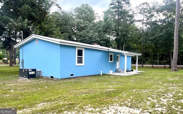 rear view of property with a yard