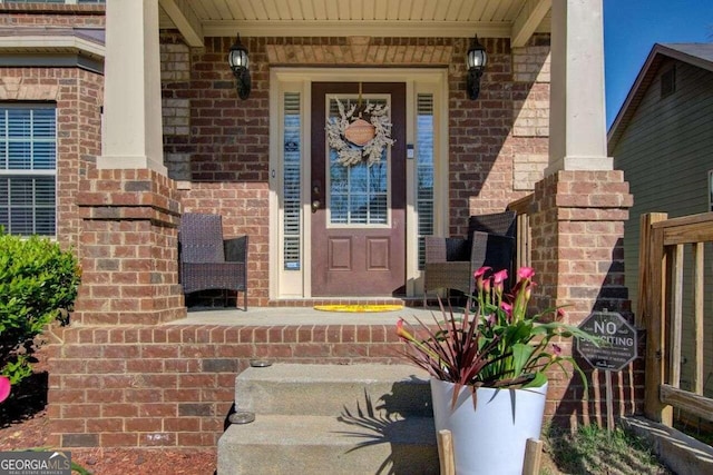 property entrance with covered porch