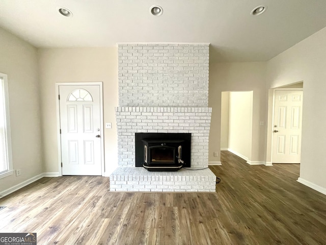 unfurnished living room with wood-type flooring