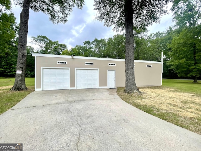 garage with a lawn