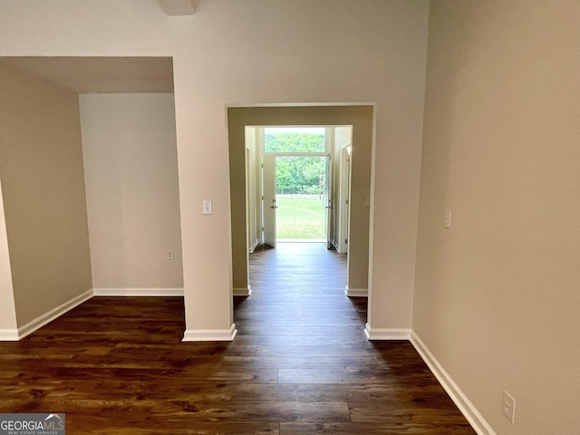 hallway with dark hardwood / wood-style floors