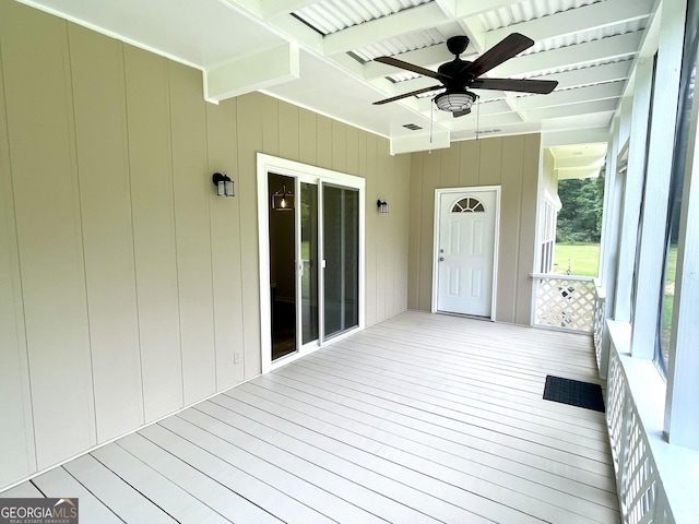 wooden deck featuring ceiling fan