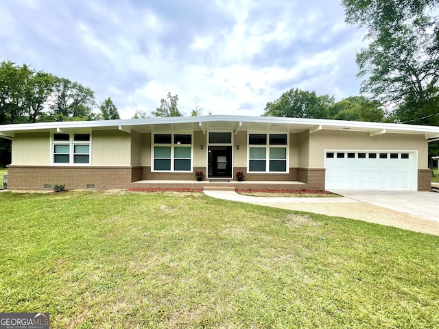 ranch-style home featuring a front yard and a garage