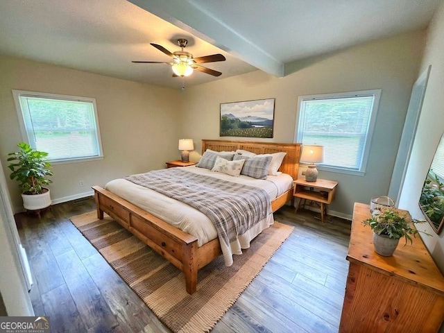 bedroom with beam ceiling, ceiling fan, and dark wood-type flooring