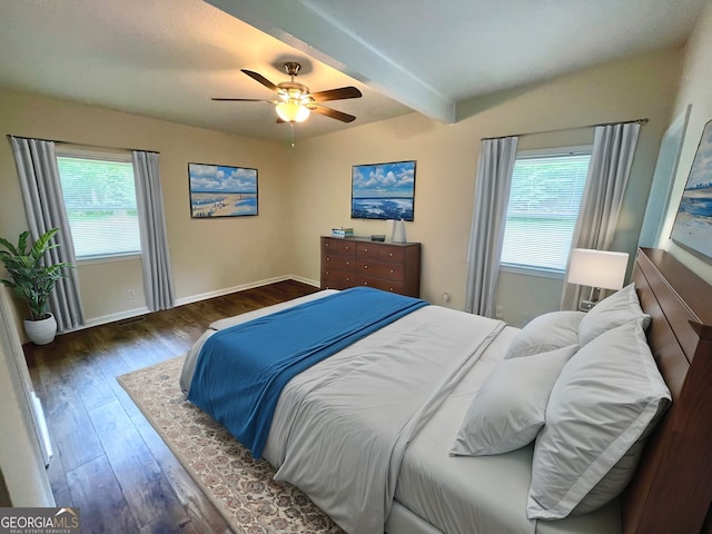 bedroom with beamed ceiling, ceiling fan, and dark hardwood / wood-style flooring