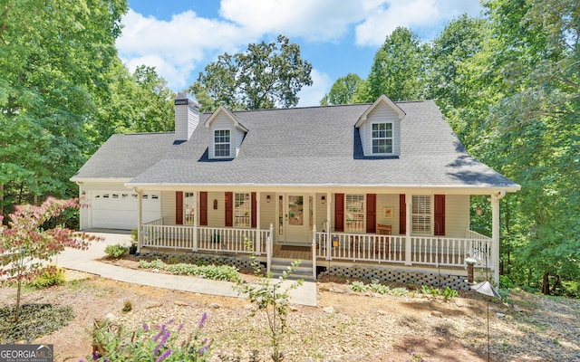 cape cod house featuring covered porch and a garage