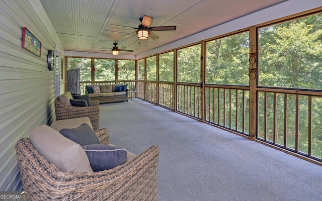 sunroom featuring plenty of natural light and ceiling fan