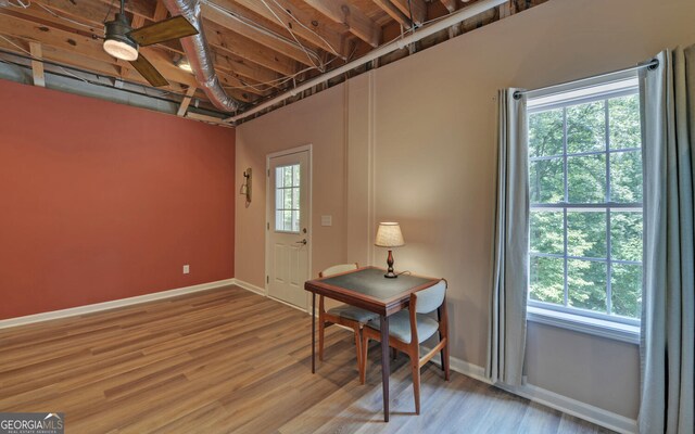 office area with ceiling fan, plenty of natural light, and hardwood / wood-style flooring