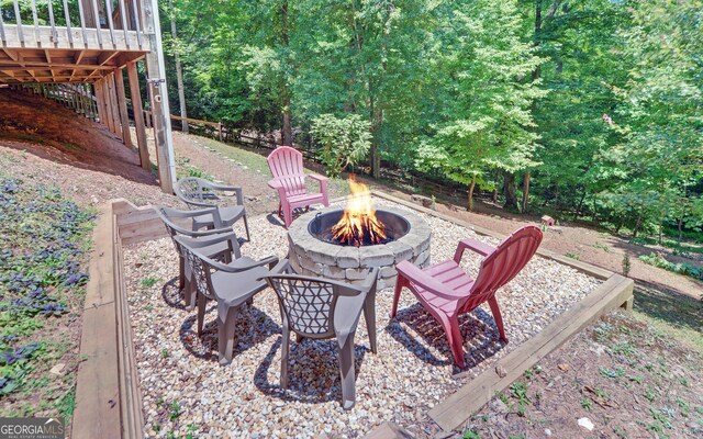 view of patio with a fire pit