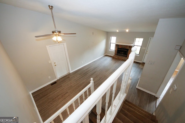 empty room with hardwood / wood-style floors and ceiling fan