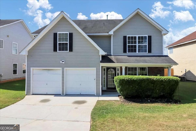 front facade with a garage and a front lawn