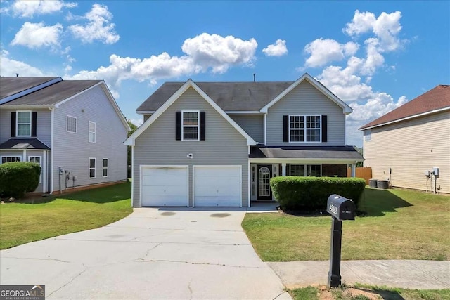 view of front property featuring a front yard and a garage