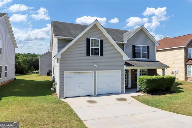 view of property with a front yard and a garage