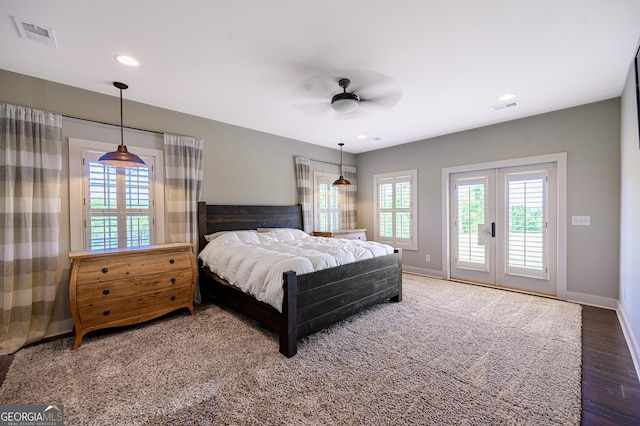 bedroom with ceiling fan, dark wood-type flooring, access to outside, and french doors