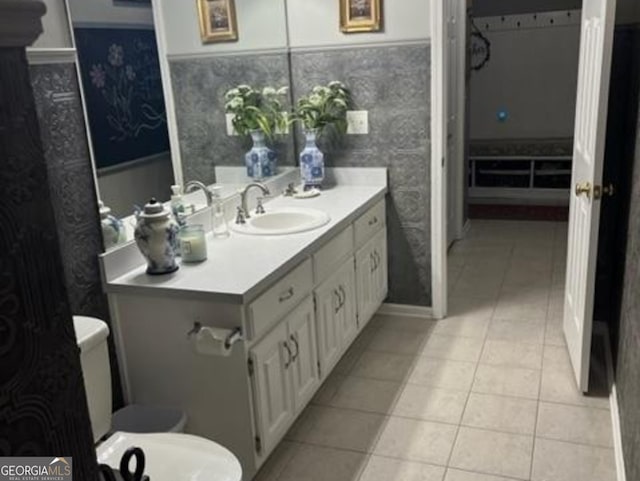 bathroom with tile patterned floors, vanity, and toilet