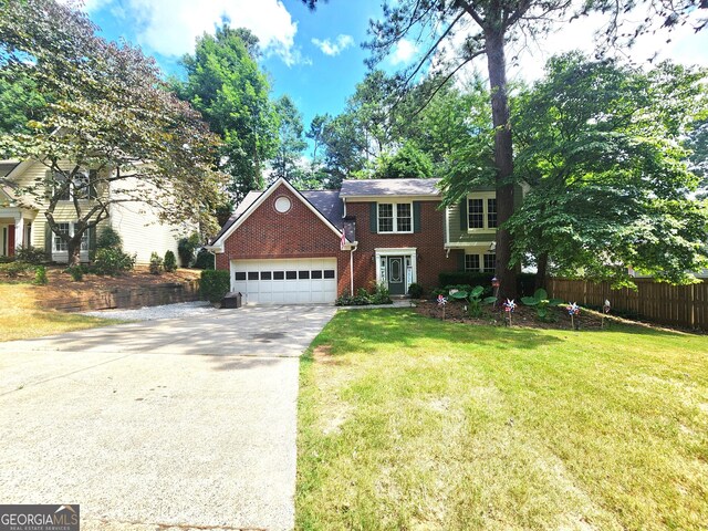 view of front of property featuring a garage and a front yard