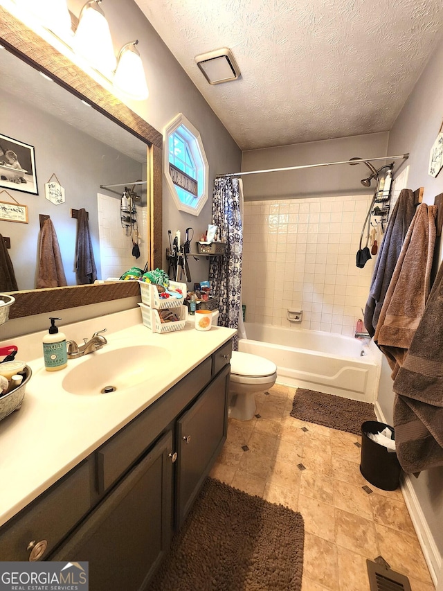 full bathroom with vanity, shower / bath combo with shower curtain, a textured ceiling, and toilet