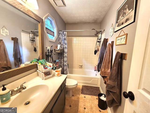 full bathroom with shower / bath combination with curtain, vanity, toilet, and a textured ceiling