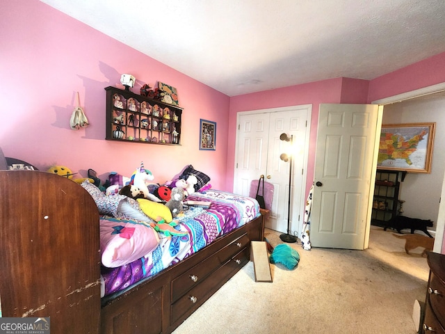 carpeted bedroom with a closet