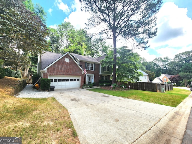 view of front facade with a garage and a front yard