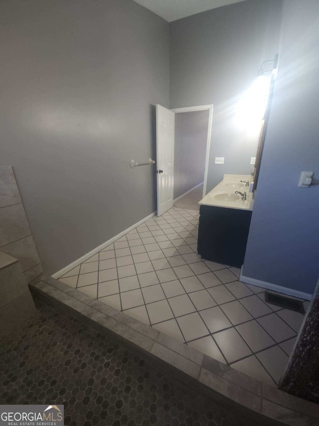 bathroom with tile patterned flooring and vanity