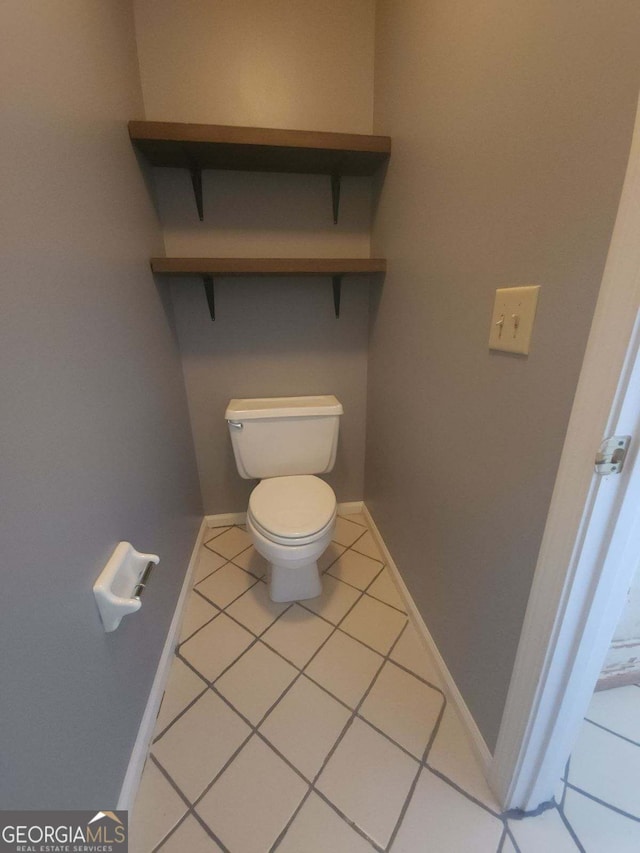 bathroom featuring tile patterned flooring and toilet