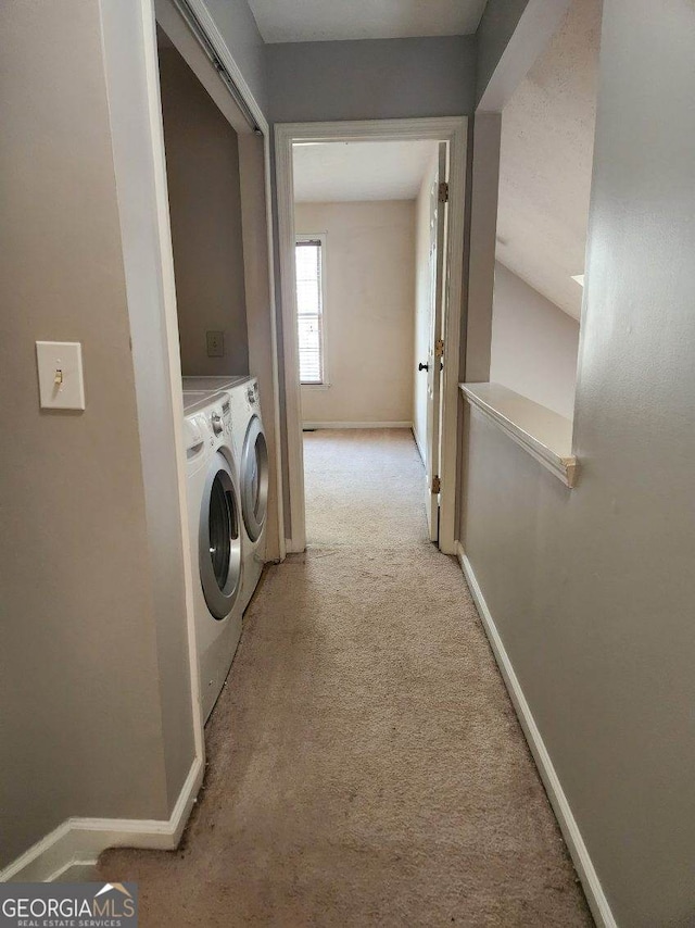 washroom featuring light carpet and washing machine and clothes dryer