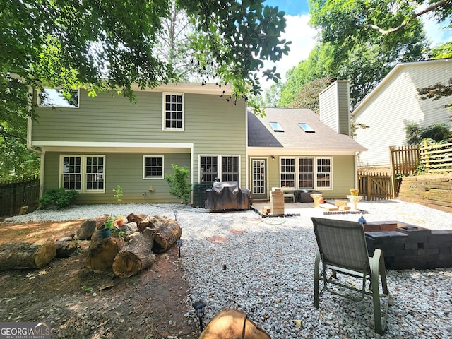 back of house with a patio