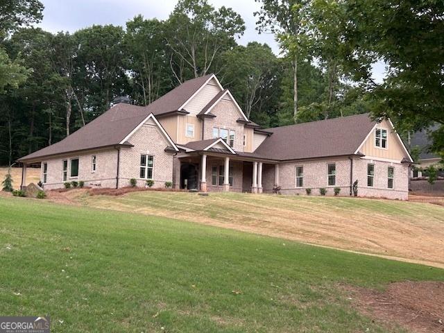 4563 Fawn Path, Gainesville, GA 30506 - craftsman-style house with a front yard, brick siding, and a porch