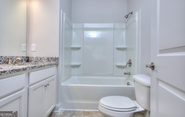 full bathroom featuring vanity, bathing tub / shower combination, and toilet