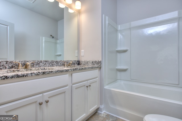 full bathroom featuring shower / tub combination, vanity, and toilet