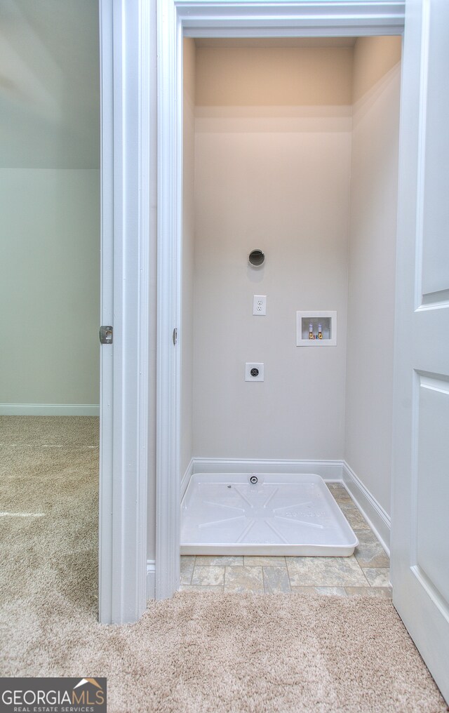 clothes washing area featuring washer hookup, carpet, and electric dryer hookup