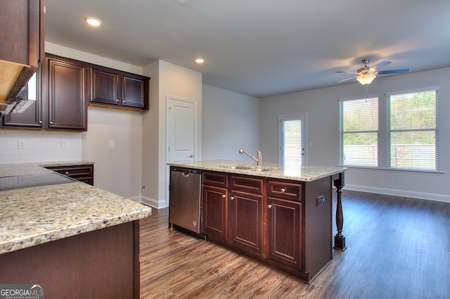 kitchen with dishwasher, dark wood-type flooring, sink, an island with sink, and ceiling fan