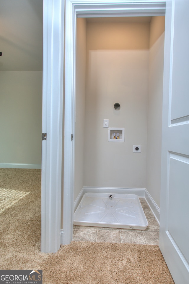 clothes washing area featuring light carpet, hookup for an electric dryer, and hookup for a washing machine