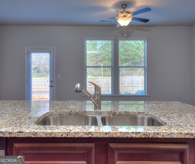 kitchen with ceiling fan, plenty of natural light, and sink